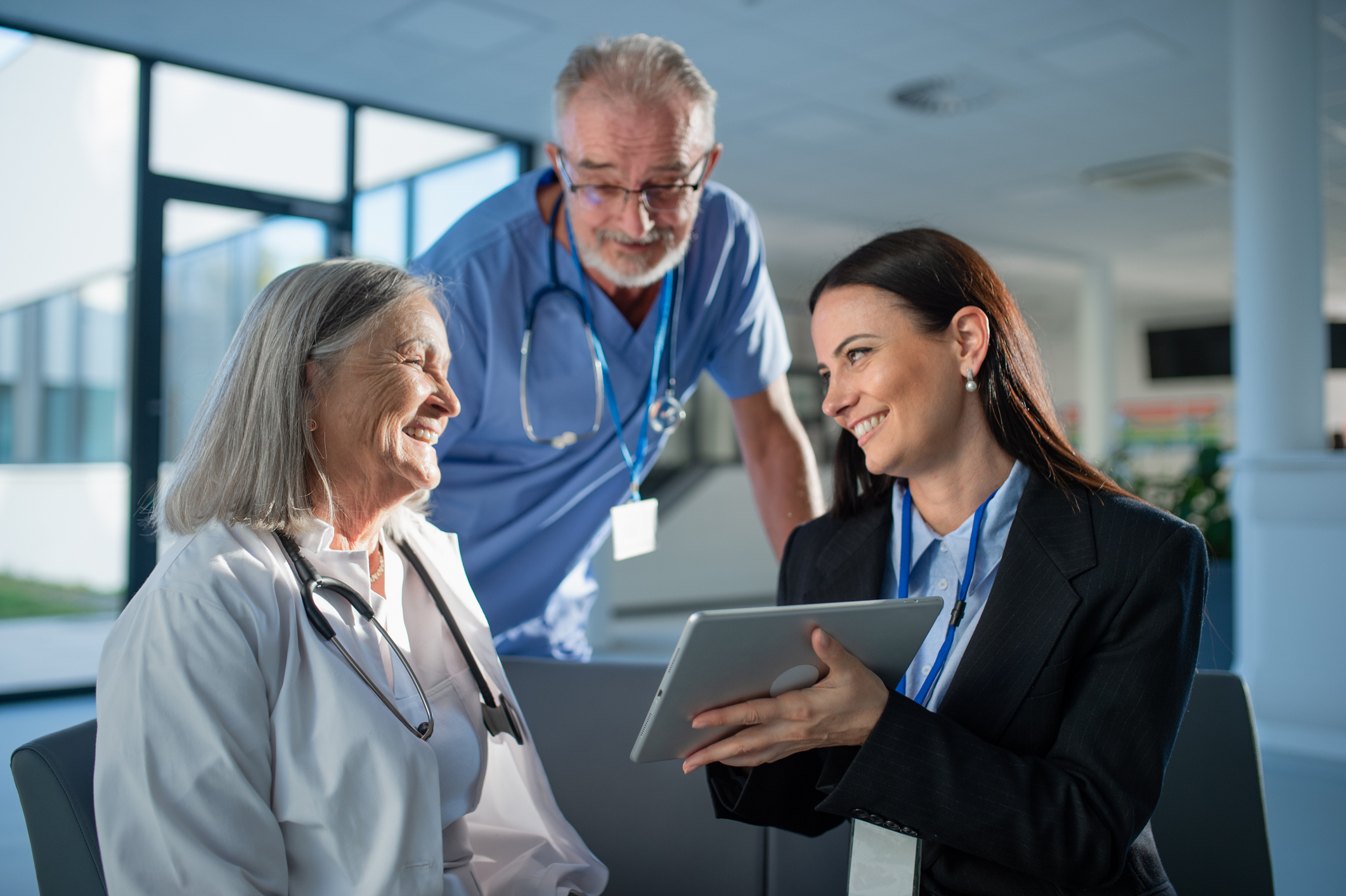 Medical professionals analyzing data on a tablet